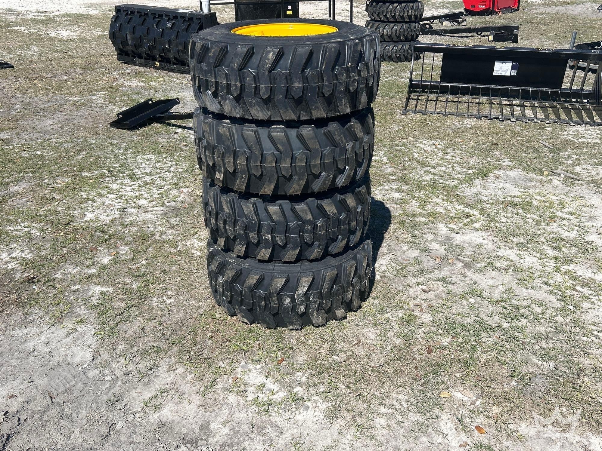 Lot of 4 12-16.5NHS Skid Steer Wheels and Tires (A61572)