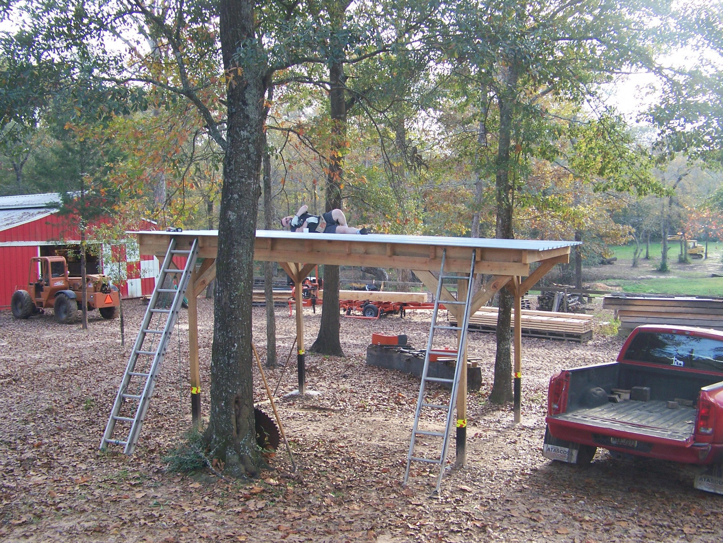 Carport Luke Laying Down On The Job.jpg