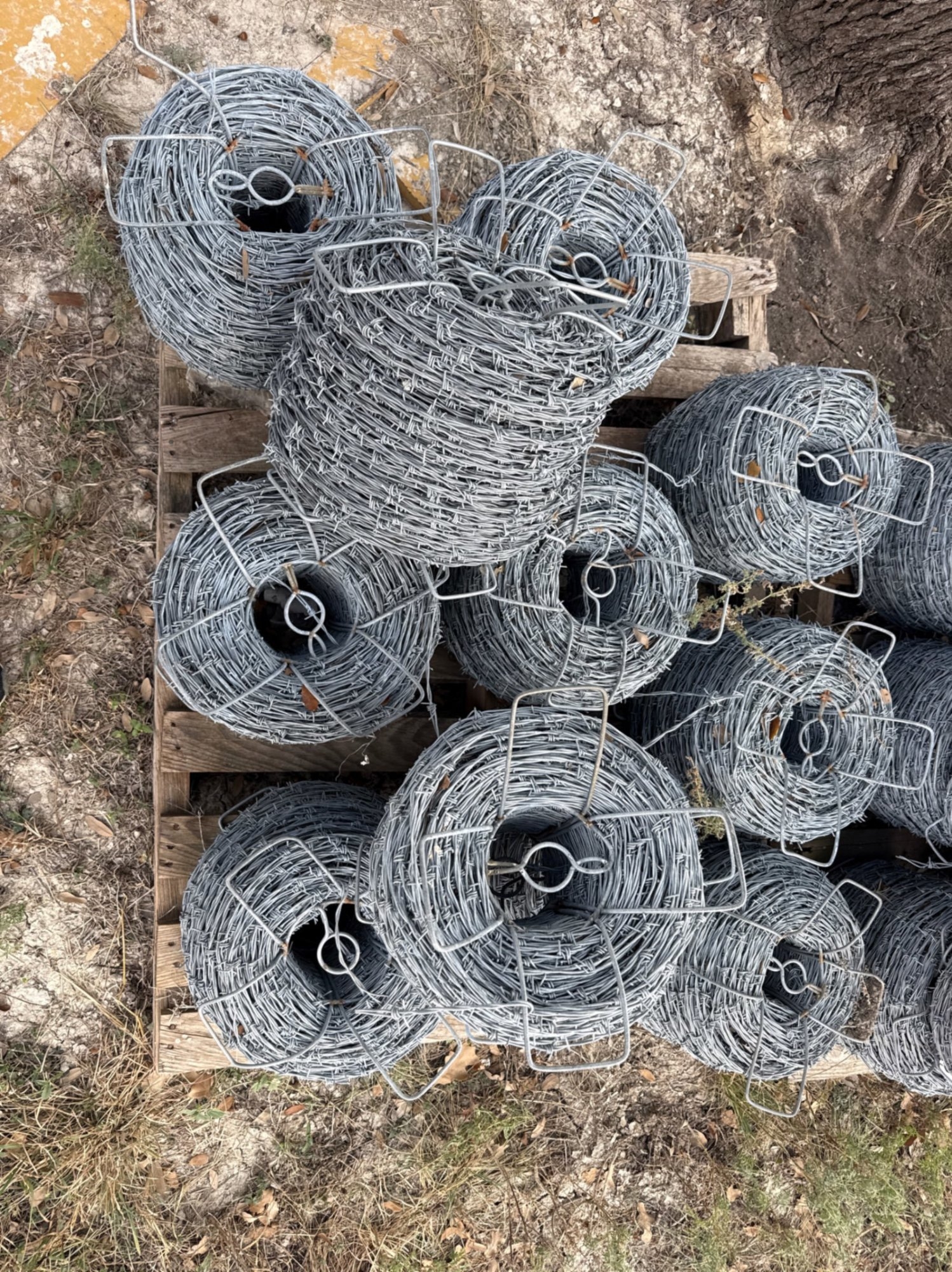 PALLET OF 11 BARBED WIRE ROLLS (A58214)