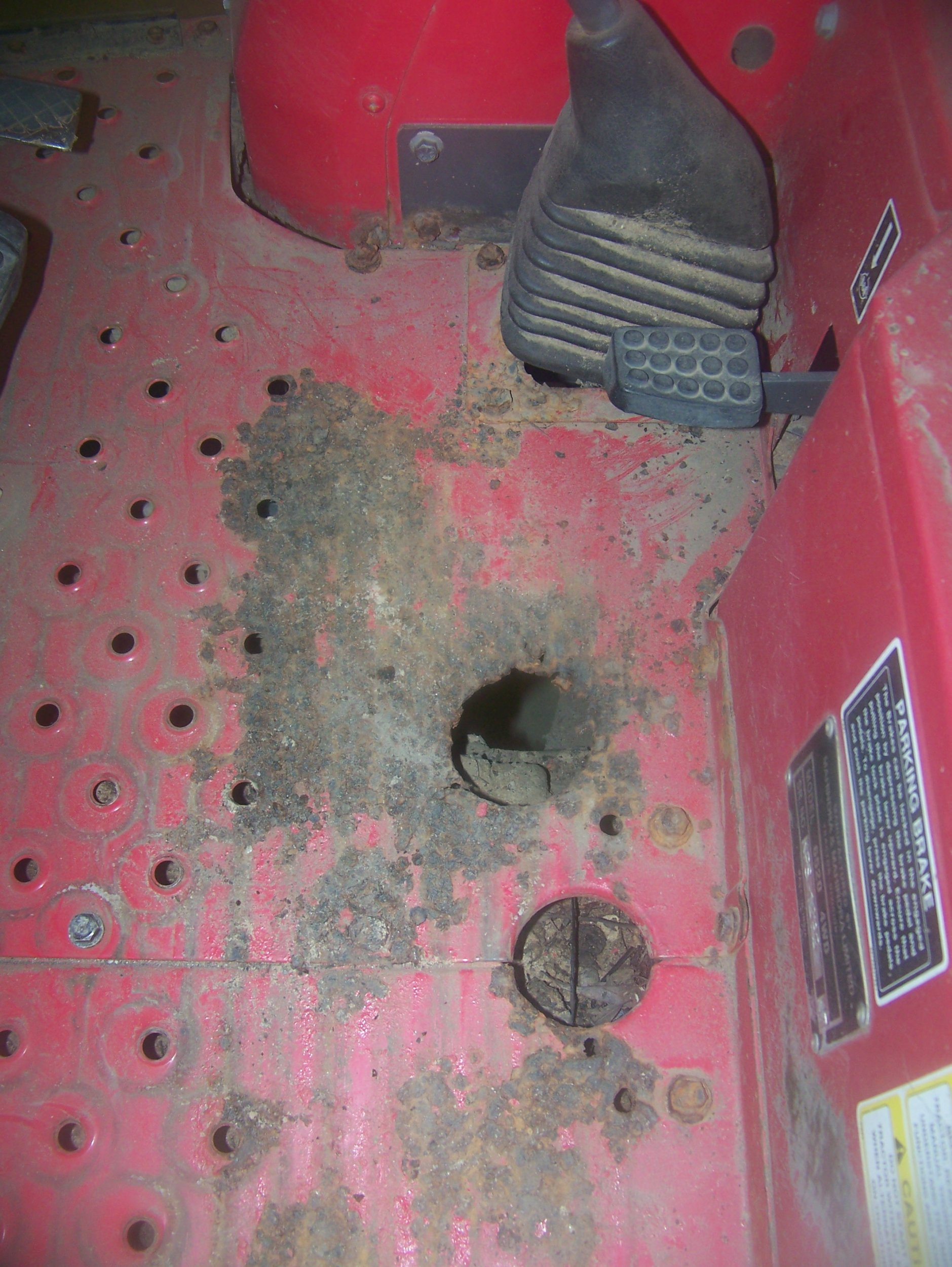 Mahindra Floor Rust Access Hole.jpg