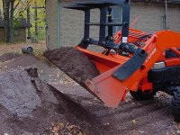 518340-bolt-on grapple - bucket filled with gravel.jpg