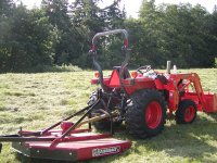 672890-Tractor-with-mower-in-field.jpg