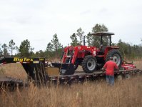 834874-tractor unloading delivery day.JPG