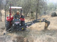 771478-TBN Backhoe Dumping Load.JPG