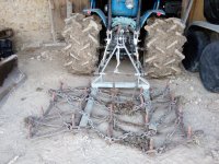 3 pallet fork with old harrow and chains.jpg