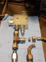 flow valve fittings on bench.jpg